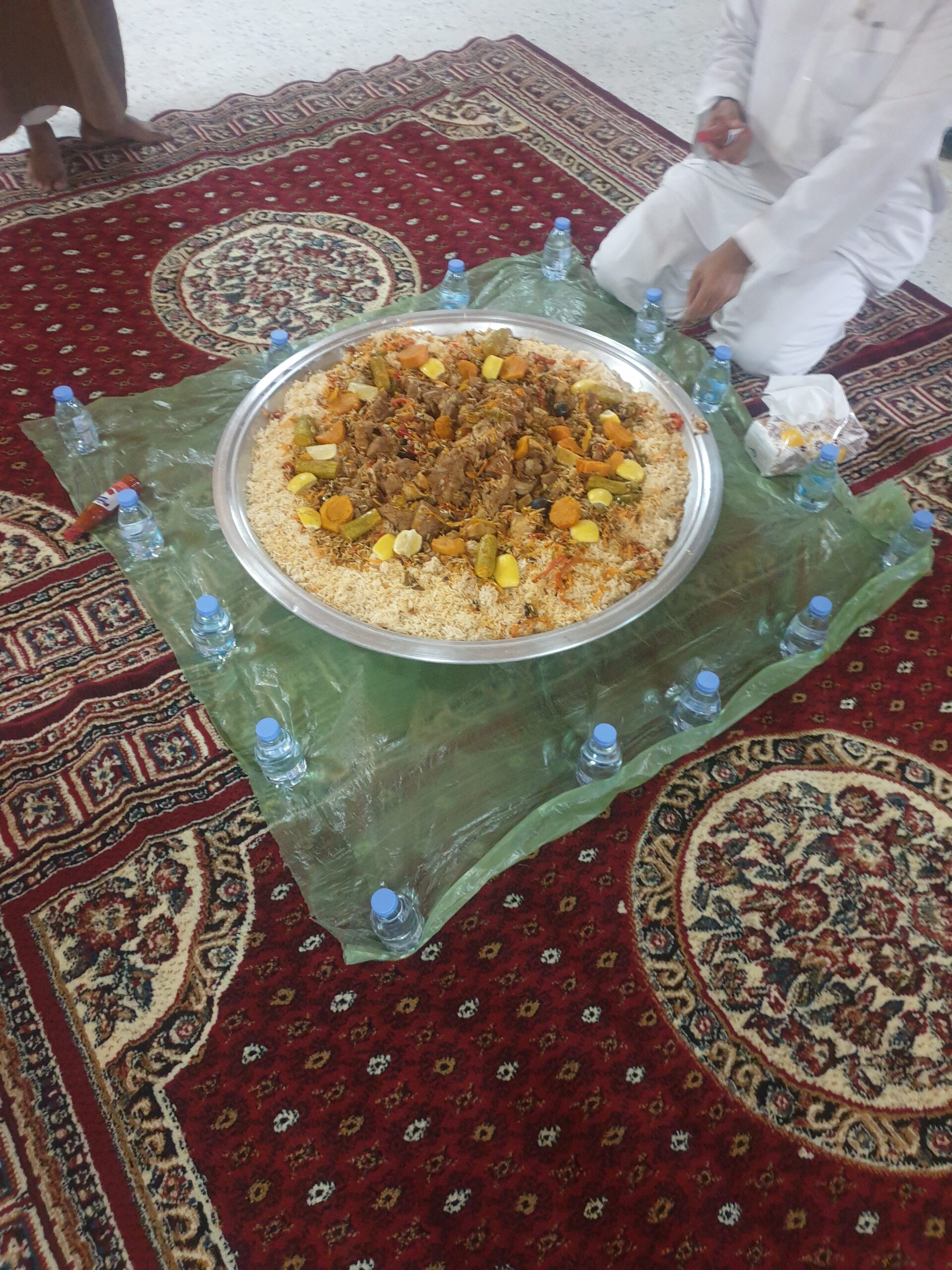 Host choosing ingredients at a local stall
